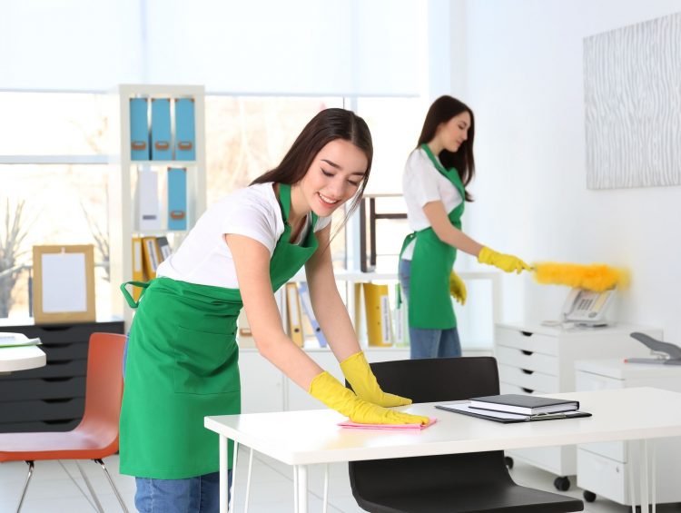 Cleaning service team working in office